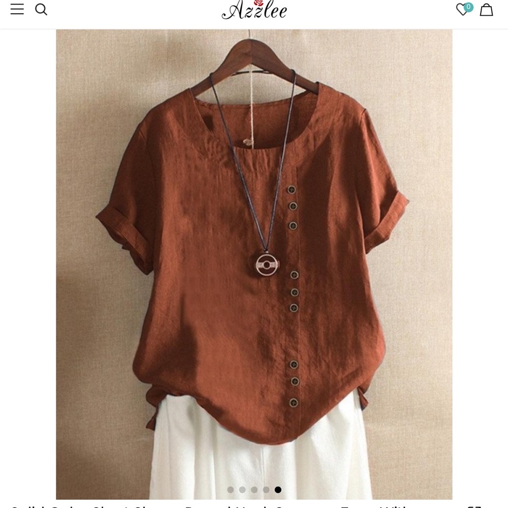 Women’s cotton/linen rust colored top with button embellishments. Size XL